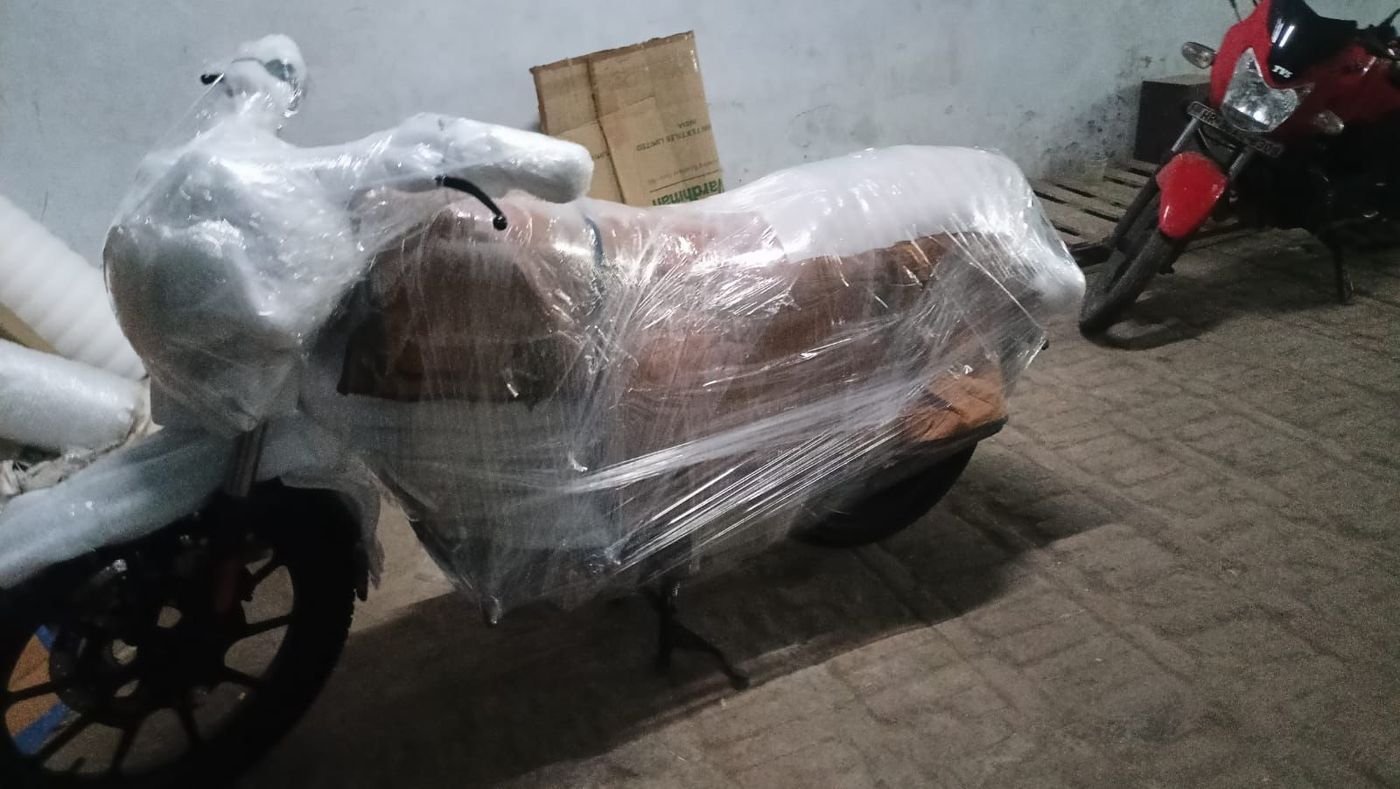 Motorcycle wrapped in protective film and bubble wrap before transport