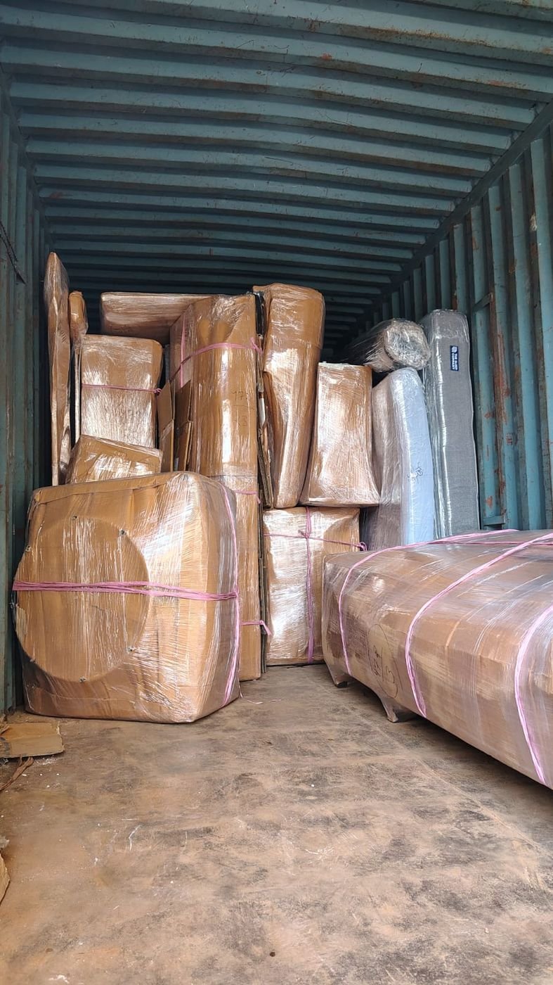 Packed and labelled goods loaded inside a container for an intercity move