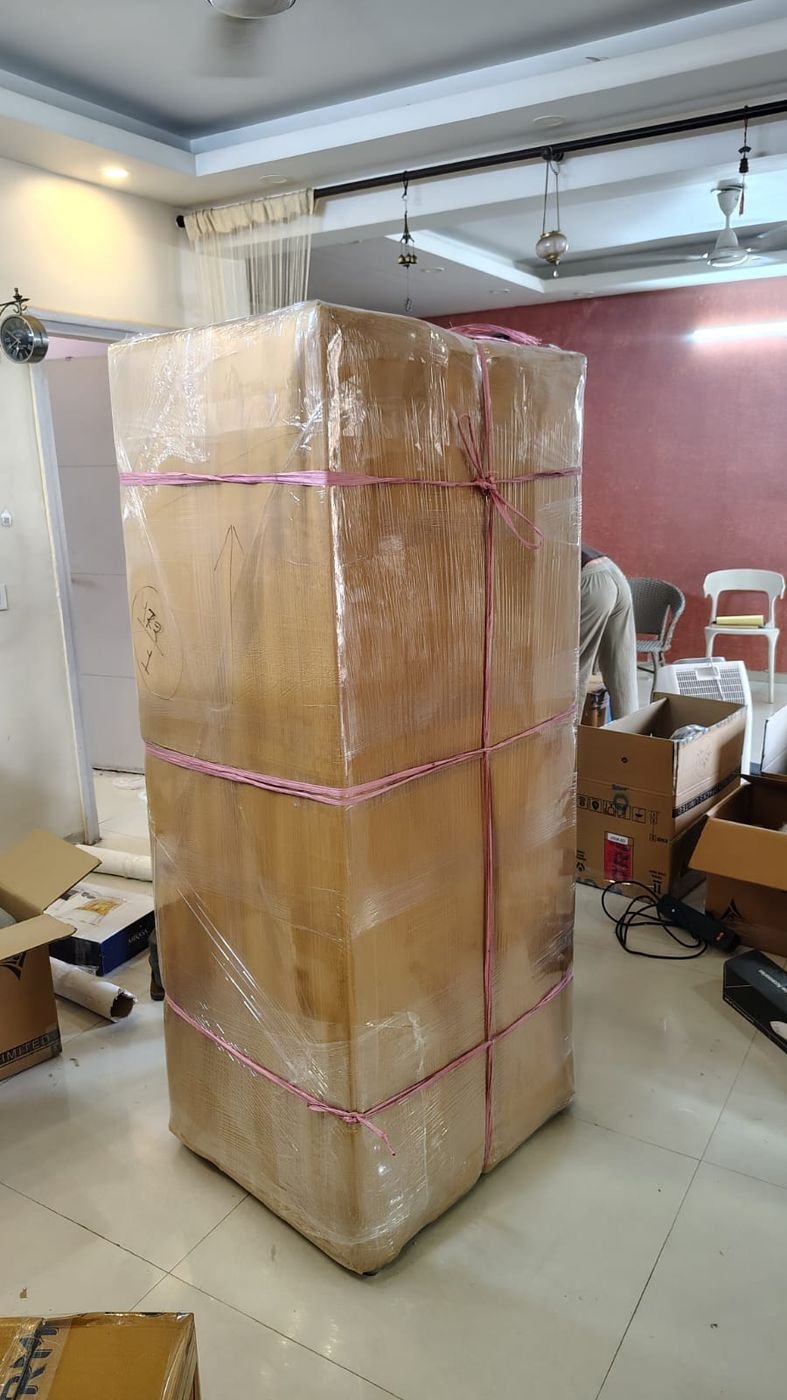 Wardrobe wrapped and ready to move, indoor packing in progress