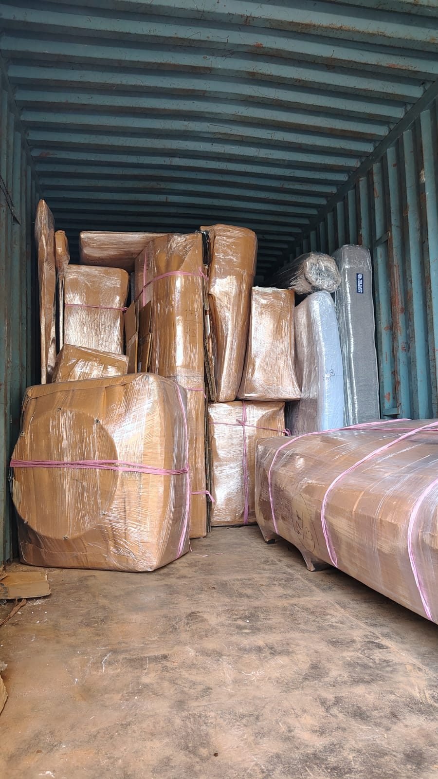 Moving truck being loaded with household consignment